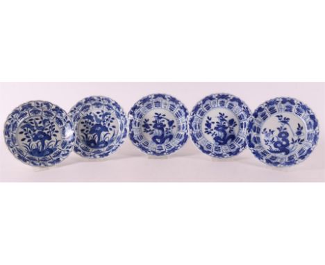 A series of five blue/white porcelain contoured saucers, China, Kangxi, around 1700. Blue underglaze decoration of, among oth