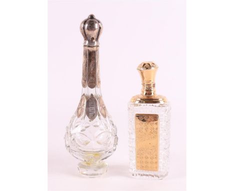 A clear crystal odeur flask with gold flip lid and frame, 19th C., including stopper, h9 cm. Here's another one with silver m