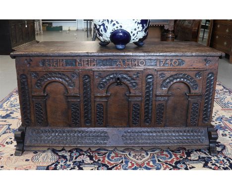 A blanket chest with a flat lid, dating from 1740. Decoration of panels and carving and text 'Hein Mein - Anno 1740' resting 