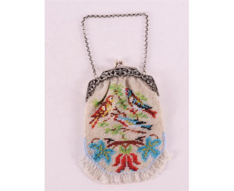 A 2nd grade 835/1000 silver purse bracket with beaded bag with bird decoration.