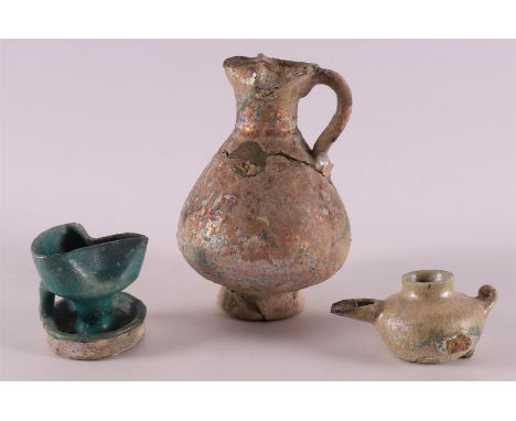 A green glazed rosewood oil lamp, 12th/13th century, h 6 cm (restoration / provenance: Lemair art dealership, Prinsengracht A