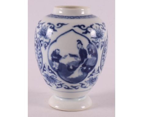 A blue and white porcelain tea caddy without lid, China, 18th century. Blue underglaze decor of two figures in a cartouche, h