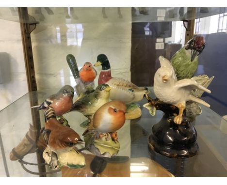 Three Beswick birds, wren, chaffinch, greenfinch, two birds marked on base, John Beswick, Royal Worcester robin, a green wood