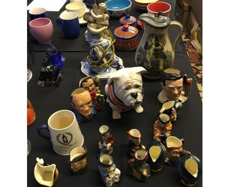 A selection of fourteen miniature Toby jugs and character jugs together with a lamp with decorative figurines, a Carltonware 