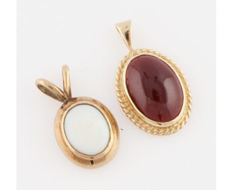 Two hallmarked 9ct yellow gold pendants, one set with garnet cabochon, the other with an opal cabochon, total lot weight appr