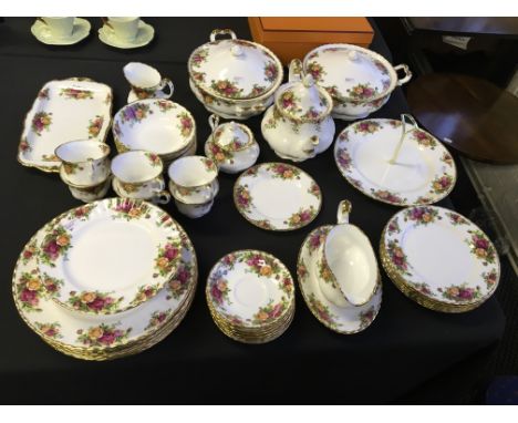 A Royal Albert tea and dinner service including teapot, cake stand, turines, etc.