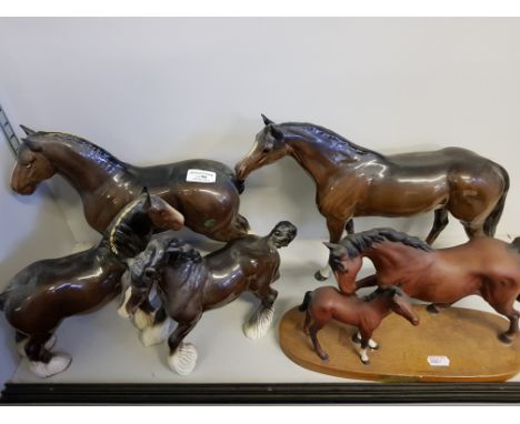 A large Beswick cart horse, and two smaller Beswick cart horses, a Beswick mare and foal, 'Spirit of affection' on wood base,