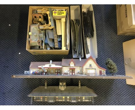 A selection of model train tracks, station and other buildings.