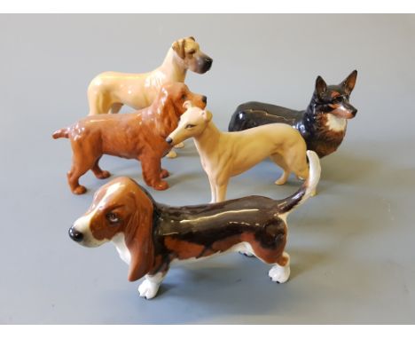 Six assorted Beswick ceramic dogs.