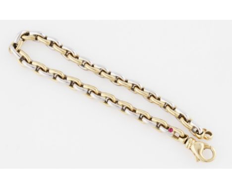 A bi-metal belcher link bracelet, set with a round cut ruby (possibly synthetic), stamped K18, weight approx. 42.5g.