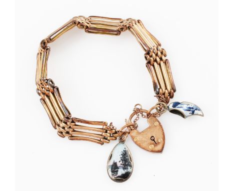A gate bracelet, four links wide, indistinctly stamped, with a heart padlock clasp, indistinctly stamped, with attached ename