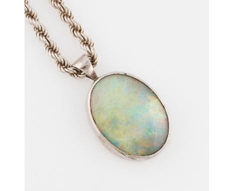 An opal doublet pendant, measuring approx. 19x14mm, set in unmarked white metal, on a hallmarked silver rope twist chain.