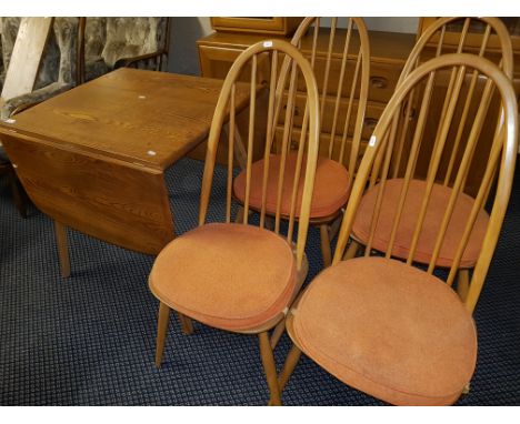 An Ercol oak drop leaf table, together with four arch stick back chairs.