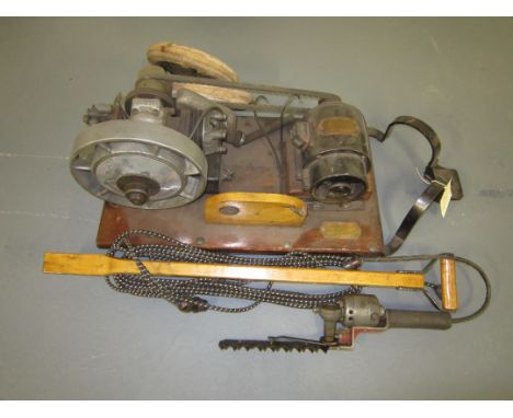 A Villers Dexter garden engine used for powering an electric trimmer together with a small hedge cutter and cable.