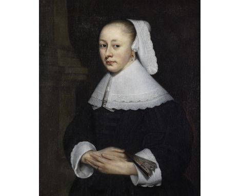 Circle of Bartholomeus van der Helst (Haarlem 1613-1670 Amsterdam)Portrait of a lady, half-length, in a black dress holding a