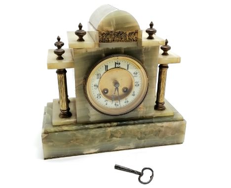 Antique onyx and gilt metal mounted continental mantle clock with key. 28cm x 26.5cm high. Running