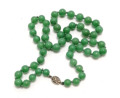 60cm strand of green hardstone beads - jade? with a silver clasp