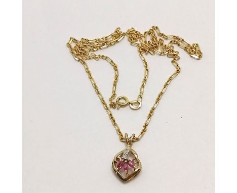 9ct hallmarked gold diamond &amp; ruby(?) pendant on a 9ct hallmarked gold 44cm chain - total weight 3.2g 
