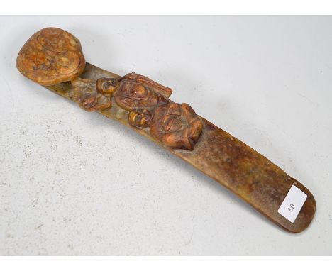 Ruyi sceptreRed-brown jadeite, nephrite, with fully sculpted carvings of 2 monks with water lily leaves, a pommel on the reve