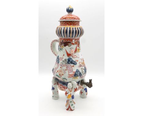 Elaborate small Kraan jug, probably 19th century.Height 36cm, feet in the shape of monks, baluster shape with beaded and ribb