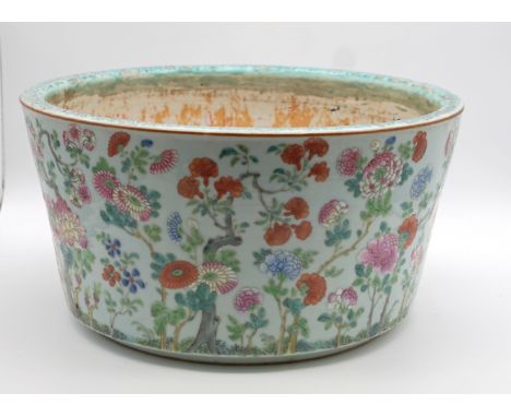 Peony Garden" Flower Pot Thongzhi 19th century.Ochre-coloured shard, celadon green ground, painted with a dense ornament of f