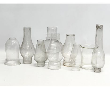 A quantity of 19th and 20th Century glass oil lamp funnels.