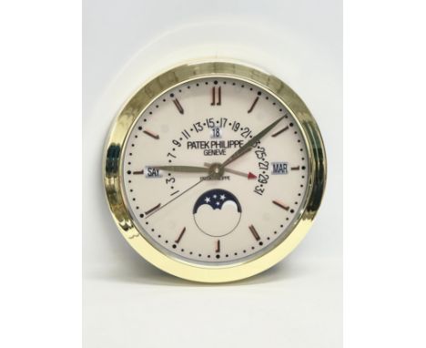 A Patek Philippe advertising wall clock. 40cm