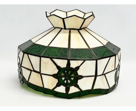 A large Tiffany style lamp shade.31x23cm