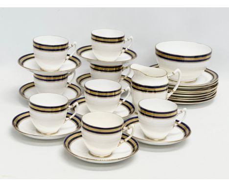 A 1920’s Royal Albert 26 piece tea service. Classical French Empire style. 8 sandwich plates, 8 tea cups, 8 saucers, cream ju