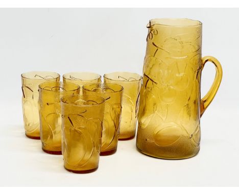 A Italian Mid Century amber glass drinks set. Empoli, Italy. Pitcher 24cm. Glasses 12cm