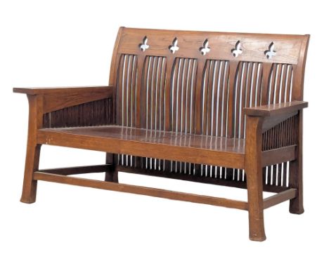 An Arts &amp; Crafts / Neogothic style teak hall bench. 140x66x86cm