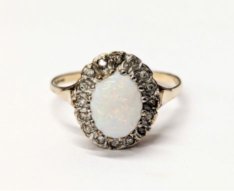 A 9ct gold and opal ring. Size UK Q