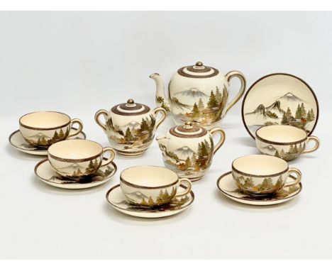An Early 20th Century Japanese Satsuma, hand painted tea service. Late Meiji Period (1868-1912) 5 cups and saucers. Teapot. C