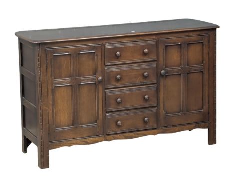 An Ercol mid century Elm &amp; beech sideboard, 146cm x 50cm x 90cm. 4