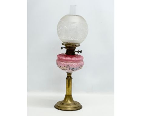 A 19th Century Victorian double burner oil lamp. With painted pink glass bowl and brass column. 65cm