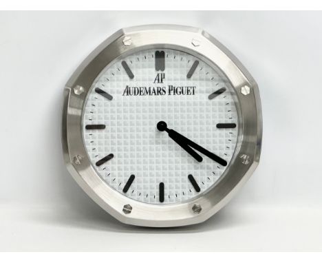 An AP Audemars Piguet adverting wall clock. 34cm