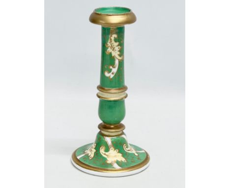 A 19th Century painted porcelain candlestick. 18.5cm