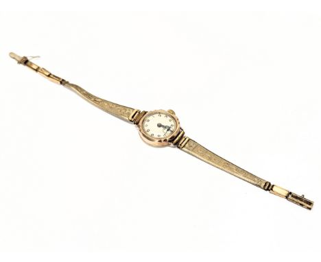 A vintage ladies 9ct gold cased watch with rolled gold straps.