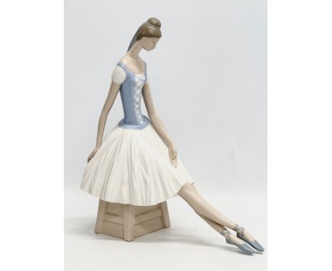 A large NAO pottery seated ballerina figurine. With box. 29x35cm
