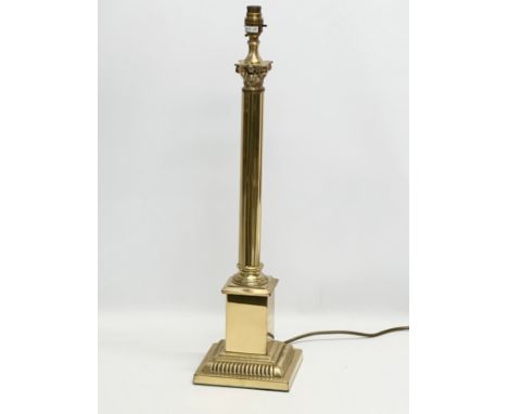 A large brass table lamp with Corinthian style column. 17x65cm