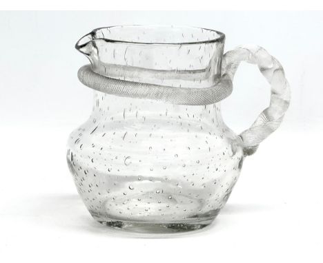 A Late 19th Century controlled bubble glass pitcher with turned rope handle. 16x12.5x13.5cm