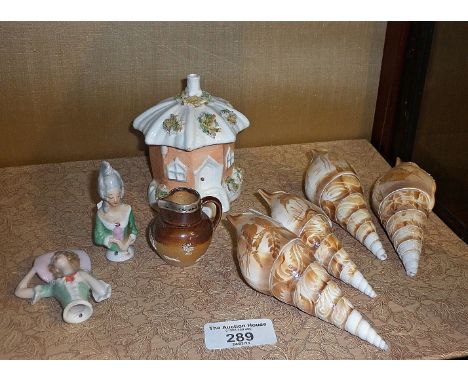 Four cameo carved shells, miniature stoneware Doulton jug with hallmarked silver rim, pincushion dolls and a Staffordshire co