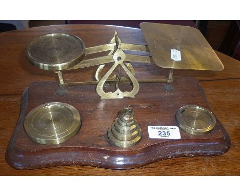 Brass and mahogany postal scales with weights