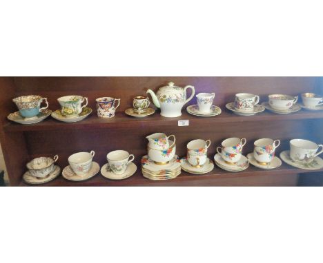 Various china tea cups and saucers, inc. Shelley teapot, Carlton china tea set, Royal Albert, etc., and an early Royal Capodi