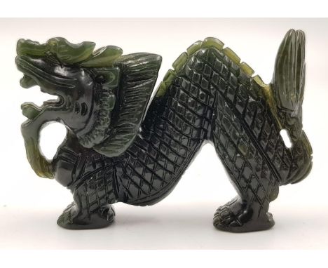 A Delicately Carved Green Jade Dragon. 6cm, 37g 