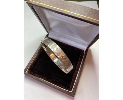 Vintage Silver BANGLE having chased pattern to one side.  Boxed.  Clear Hallmark for Birmingham 1971. 