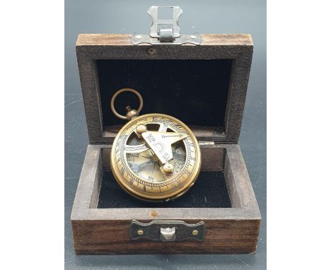 An Antique Brass Nautical Compass made by Ross London. Comes in original box - 4.5cm dia. 