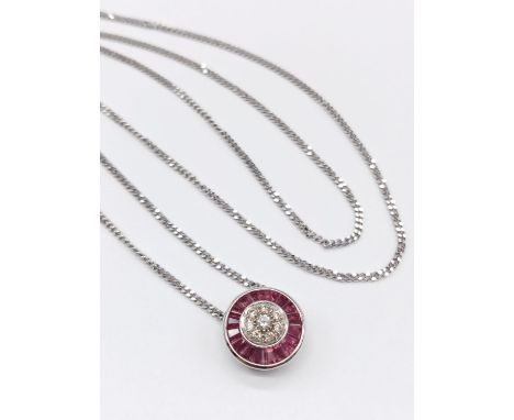 Diamond and Ruby circular PENDANT on a 9ct White Gold CHAIN.   5.4g      54cm  chain 