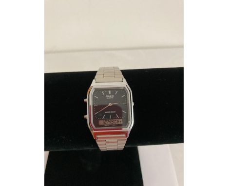 Vintage Casio AQ 230 WRISTWATCH.  Black face.  Model with alarm feature.  Casio metal strap. Full Working Order. 