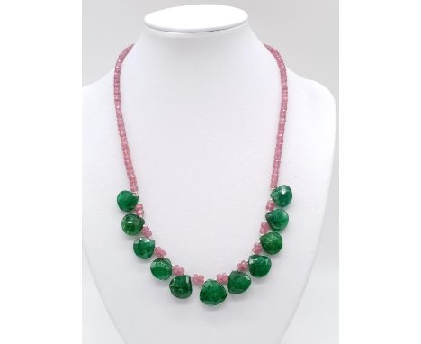 172cts light pink ruby gemstone necklace with emerald heart shape drops. 33.72 grams in weight. 44cm approx in length. 